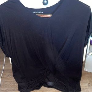 American eagle tee with a cross in the frount